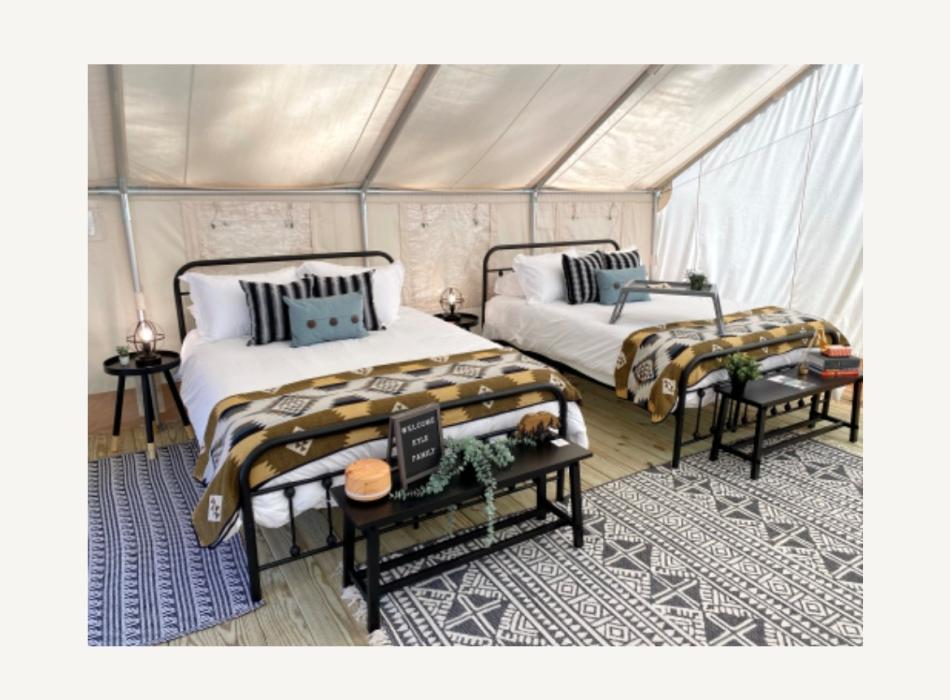 Two beds inside the glamping tent at Hillsborough River State Park.